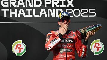 Ducati Lenovo's Spanish rider Marc Marquez celebrates on the podium after winning the MotoGP Thailand Grand Prix at the Buriram International Circuit in Buriram on March 2, 2025. (Photo by Lillian SUWANRUMPHA / AFP)