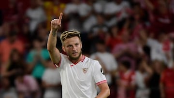 (FILES) Sevilla's Croatian midfielder #10 Ivan Rakitic celebrates scoring his team's second goal that was later annulled during the Spanish Liga football match between Sevilla FC and Girona FC at the Ramon Sanchez Pizjuan stadium in Seville on August 26, 2023. Former Croatia international Ivan Rakitic announced his retirement from football on July 7, 2025 at the age of 37. (Photo by CRISTINA QUICLER / AFP)