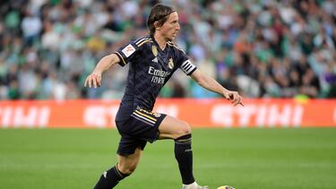 Real Madrid's Croatian midfielder #10 Luka Modric runs with the ball during the Spanish league football match between Real Betis and Real Madrid CF at the Benito Villamarin stadium in Seville on December 9, 2023. (Photo by CRISTINA QUICLER / AFP)