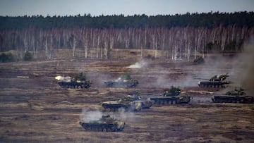 This handout video grab released by the Russian Defence Ministry on February 21, 2022, shows Russian and Belarus tanks during joint exercises of the armed forces of Russia and Belarus as part of an inspection of the Union State's Response Force, at a
