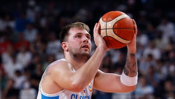 Basketball - FIBA World Cup 2023 - First Round - Group F - Slovenia v Venezuela - Okinawa Arena, Okinawa, Japan - August 26, 2023 Slovenia's Luka Doncic scores a free throw REUTERS/Issei Kato