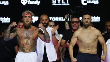 ANAHEIM, CALIFORNIA - JUNE 27: Jake Paul and Julio Cesar Chavez Jr. react during a ceremonial weigh-in before their fight at Honda Center on June 27, 2025 in Anaheim, California. Harry How/Getty Images/AFP (Photo by Harry How / GETTY IMAGES NORTH AMERICA / Getty Images via AFP)