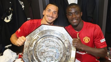 LONDON, ENGLAND - AUGUST 07: (EXCLUSIVE COVERAGE) Zlatan Ibrahimovic and Eric Bailly of Manchester United pose with the Community Shield trophy in the dressing room after the FA Community Shield match between Leicester City and Manchester United at Wembley Stadium on August 7, 2016 in London, England. (Photo by John Peters/Manchester United via Getty Images)