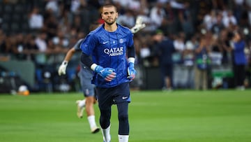 Paris Saint-Germain's French goalkeeper #30 Lucas Chevalier runs during the warm up ahead of the 2025 UEFA Super Cup final football match between Paris Saint-Germain (FRA) and Tottenham Hotspur FC (ENG) at the Friuli stadium, in Udine, on August 13, 2025. (Photo by FRANCK FIFE / AFP)