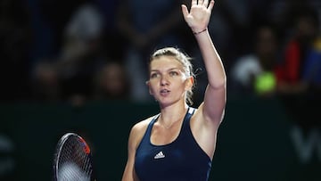 SINGAPORE - OCTOBER 23: Simona Halep of Romania celebrates victory in her singles match against Madison Keys of the United States during day 1 of the BNP Paribas WTA Finals Singapore at Singapore Sports Hub on October 23, 2016 in Singapore. (Photo by Julian Finney/Getty Images)