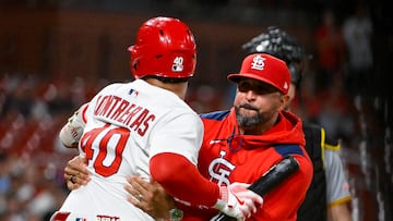 Aug 25, 2025; St. Louis, Missouri, USA; St. Louis Cardinals designated hitter Willson Contreras (40) is held back by manager Oliver Marmol (37) after he was ejected by umpire Derek Thomas (not pictured) during the seventh inning against the Pittsburgh Pirates at Busch Stadium. Mandatory Credit: Jeff Curry-Imagn Images
