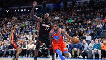 Dec 14, 2022; Oklahoma City, Oklahoma, USA; Oklahoma City Thunder guard Isaiah Joe (11) drives to the basket around Miami Heat center Dewayne Dedmon (21) during the second half at Paycom Center. Miami won 110-108. Mandatory Credit: Alonzo Adams-USA TODAY Sports