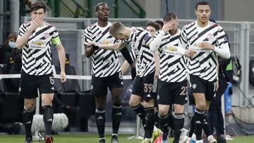 Manchester United's Paul Pogba, second left, is congratulated by teammates after scoring his team's first goal during the Europa League round of 16 second leg soccer match between AC Milan and Manchester United at the San Siro Stadium, in Milan,
