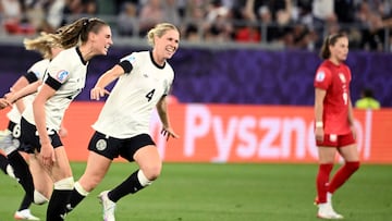 Germany's midfielder #22 Jule Brand celebrates her goal with teammate Germany's defender #04 Rebecca Knaak during the UEFA Women's Euro 2025 Group C football match between Germany and Poland at the Arena St.Gallen in St.Gallen on July 4, 2025. (Photo by SEBASTIEN BOZON / AFP)