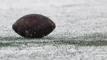 FOXBOROUGH, MASSACHUSETTS - JANUARY 07: A football is seen in the snow during a game between the New York Jets and New England Patriots at Gillette Stadium on January 07, 2024 in Foxborough, Massachusetts. Winslow Townson/Getty Images/AFP (Photo by Winslow Townson / GETTY IMAGES NORTH AMERICA / Getty Images via AFP)