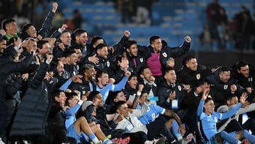 Uruguay's players celebrate at the end of the 2026 FIFA World Cup South American qualifiers football match between Uruguay and Peru at the Centenario stadium in Montevideo on September 4, 2025. (Photo by Eitan ABRAMOVICH / AFP)