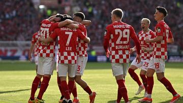 Mainz' South Korean midfielder #07 Jae-sung Lee (3rdL) celebrates with team mates after scoring the 3-0 goal during the German first division Bundesliga football match between Mainz 05 and BVB Borussia Dortmund in Mainz, western Germany on May 11, 2024. (Photo by Kirill KUDRYAVTSEV / AFP) / DFL REGULATIONS PROHIBIT ANY USE OF PHOTOGRAPHS AS IMAGE SEQUENCES AND/OR QUASI-VIDEO