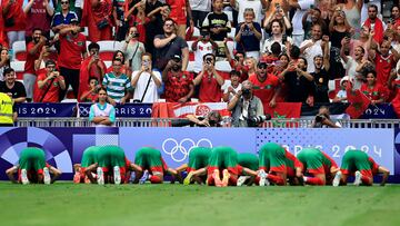 Morocco's players celebrate after scoring their second goal in the men's group B football match between Morocco and Iraq during the Paris 2024 Olympic Games at the Nice Stadium in Nice on July 30, 2024. (Photo by Valery HACHE / AFP)