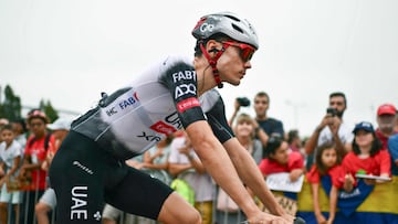 Team UAE's Spanish rider Juan Ayuso arrives to compete in the second stage of the Vuelta a Espana, a 159,6 km race between Alba and Limone Piemonte, in Italy's Piemonte region, on August 24, 2025. (Photo by Marco BERTORELLO / AFP)