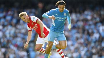 MANCHESTER, ENGLAND - AUGUST 28: Jack Grealish of Manchester City battles for possession with Martin Odegaard of Arsenal during the Premier League match between Manchester City and Arsenal at Etihad Stadium on August 28, 2021 in Manchester, England. (Pho