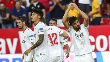 Sevilla's forward Nolito (R) celebrates with teammates after scoring a goal during the Spanish Liga football match Sevilla FC vs SD Eibar at the Ramon Sanchez Pizjuan stadium in Sevilla on September 9, 2017. / AFP PHOTO / CRISTINA QUICLER