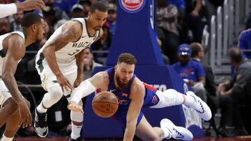 Apr 20, 2019; Detroit, MI, USA; Detroit Pistons forward Blake Griffin (23) dives for the loose ball against Milwaukee Bucks guard George Hill (3) during the fourth quarter at Little Caesars Arena. Mandatory Credit: Raj Mehta-USA TODAY Sports