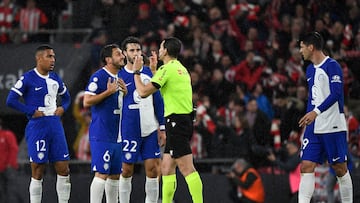 Atletico Madrid's Spanish midfielder #06 Koke and teammates, remonstrate Spanish referee Juan Martinez Munuera during the Spanish Copa del Rey (King's Cup) semi final second leg football match between Athletic Club Bilbao and Club Atletico de Madrid at the San Mames stadium in Bilbao on February 29, 2024. (Photo by ANDER GILLENEA / AFP)