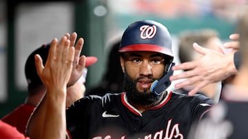 WASHINGTON, DC - JULY 21: Amed Rosario #13 of the Washington Nationals celebrates with teammates in the dugout after scoring in the sixth inning against the Cincinnati Reds at Nationals Park on July 21, 2025 in Washington, DC. Greg Fiume/Getty Images/AFP (Photo by Greg Fiume / GETTY IMAGES NORTH AMERICA / Getty Images via AFP)