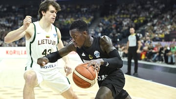 Germany's point guard #17 Dennis Schroder (R) and Lithuania's Ignas Sargiunas vie for the ball during the basketball FIBA EuroBasket 2025 group B match between Lithuania and Germany in Tampere, Finland, on August 30, 2025. (Photo by Heikki Saukkomaa / Lehtikuva / AFP) / Finland OUT