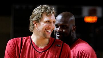 Shaquille O'Neal from the Phoenix Suns (R) and Dirk Nowitzki of Germany from the Dallas Mavericks shares a joke during team practice for the NBA All-Star game in Phoenix, Arizona February 14, 2009. REUTERS/Lucy Nicholson (UNITED STATES)