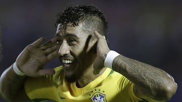 Brazil's Paulinho celebrates his hat trick during a 2018 World Cup qualifying soccer match against Uruguay in Montevideo, Uruguay, Thursday, March. 23, 2017. (AP Photo/Natacha Pisarenko)
