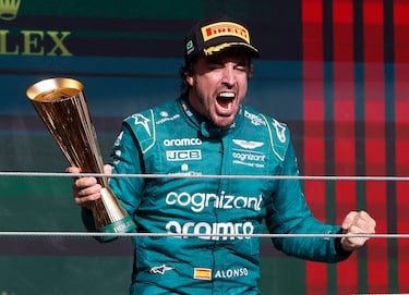 Formula One F1 - Brazilian Grand Prix - Jose Carlos Pace Circuit, Sao Paulo, Brazil - November 5, 2023 Aston Martin's Fernando Alonso celebrates with a trophy on the podium after finishing third place in the Brazilian Grand Prix REUTERS/Amanda Perobelli