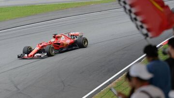 Ferrari's German driver Sebastian Vettel drives his car during the Formula One Malaysia Grand Prix in Sepang on October 1, 2017. / AFP PHOTO / Roslan Rahman