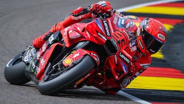 Ducati Lenovoi Team's Spanish MotoGP rider Marc Marquez steers his bike during the second practice session of the MotoGP German motorcycle Grand Prix at the Sachsenring racing circuit, in Hohenstein-Ernstthal near Chemnitz, eastern Germany on July 11, 2025. (Photo by Ronny Hartmann / AFP)