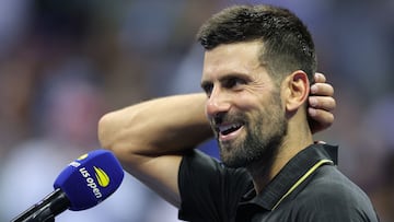 Serbia's Novak Djokovic speaks during a post-match interview after winning his men's singles first round tennis match against USA's Learner Tien on day one of the US Open tennis tournament at the USTA Billie Jean King National Tennis Center in New York City, on August 24, 2025. (Photo by CHARLY TRIBALLEAU / AFP)