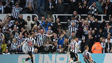 Newcastle United's English defender Dan Burn (R) celebrates with teammates after scoring his team second goal during the English Premier League football match between Newcastle United and Brighton and Hove Albion at St James' Park in Newcastle-upon-Tyne, north east England on May 18, 2023. (Photo by Oli SCARFF / AFP) / RESTRICTED TO EDITORIAL USE. No use with unauthorized audio, video, data, fixture lists, club/league logos or 'live' services. Online in-match use limited to 120 images. An additional 40 images may be used in extra time. No video emulation. Social media in-match use limited to 120 images. An additional 40 images may be used in extra time. No use in betting publications, games or single club/league/player publications. /