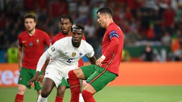 Soccer Football - Euro 2020 - Group F - Portugal v France - Puskas Arena, Budapest, Hungary - June 23, 2021 Portugal's Cristiano Ronaldo in action with France's Paul Pogba Pool via REUTERS/Franck Fife