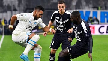 Marseille's French midfielder Dimitri Payet (L) fights for the ball with Bordeaux's French forward Nicolas de Preville (C) and Bordeaux's Senegalese defender Youssouf Sabaly during the French L1 football match between Olympique de Marseille