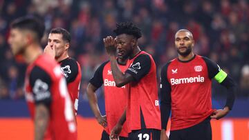 Soccer Football - Champions League - Bayer Leverkusen v Inter Milan - BayArena, Leverkusen, Germany - December 10, 2024 Bayer Leverkusen's Edmond Tapsoba and Jonathan Tah react REUTERS/Thilo Schmuelgen