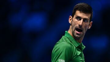 Serbia's Novak Djokovic reacts during his round-robin match against Russia's Andrey Rublev on November 16, 2022 at the ATP Finals tennis tournament in Turin. (Photo by Marco BERTORELLO / AFP)