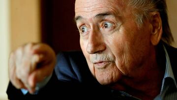 FILE PHOTO: Former FIFA President Sepp Blatter speaks with reporters in Zurich, Switzerland March 8, 2018. REUTERS/Arnd Wiegmann -/File Photo