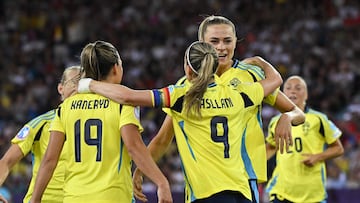 Sweden's forward #18 Fridolina Rolfo (2nd R) celebrates after scoring her team's third goal during the UEFA Women's Euro 2025 Group C football match between Sweden and Germany at Letzigrund Stadium in Zurich, on July 12, 2025. (Photo by Miguel MEDINA / AFP)
