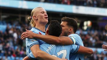 Soccer Football - Premier League - Manchester City v Southampton - Etihad Stadium, Manchester, Britain - October 26, 2024 Manchester City's Erling Haaland celebrates scoring their first goal with Manchester City's Matheus Nunes and Manchester City's Ruben Dias Action Images via Reuters/Lee Smith EDITORIAL USE ONLY. NO USE WITH UNAUTHORIZED AUDIO, VIDEO, DATA, FIXTURE LISTS, CLUB/LEAGUE LOGOS OR 'LIVE' SERVICES. ONLINE IN-MATCH USE LIMITED TO 120 IMAGES, NO VIDEO EMULATION. NO USE IN BETTING, GAMES OR SINGLE CLUB/LEAGUE/PLAYER PUBLICATIONS. PLEASE CONTACT YOUR ACCOUNT REPRESENTATIVE FOR FURTHER DETAILS..