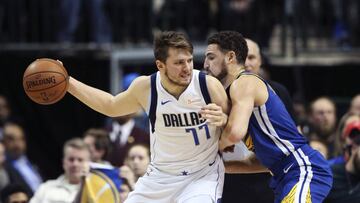 Jan 13, 2019; Dallas, TX, USA; Dallas Mavericks guard Luka Doncic (77) dribbles as Golden State Warriors guard Klay Thompson (11) defends during the second half at American Airlines Center. Mandatory Credit: Kevin Jairaj-USA TODAY Sports