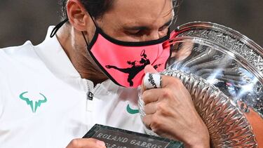 Spain's Rafael Nadal kisses the Mousquetaires Cup (The Musketeers) as he celebrates during the podium ceremony after winning the men's singles final tennis match against Serbia's Novak Djokovic at the Philippe Chatrier court, on Day 15 of The Roland Garro