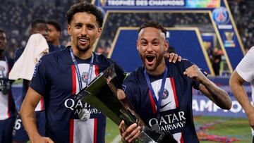 Paris Saint-Germain's Brazilian defender Marquinhos (L) and Paris Saint-Germain's Brazilian forward Neymar hold the winners cup after their 4-0 win in the French Champions' Trophy (Trophee des Champions) final football match, Paris Saint-Germain versus FC Nantes, in the at the Bloomfield Stadium, in Tel Aviv on July 31, 2022. - Paris Saint-Germain (PSG) beat Nantes 4-0 to clinch the trophy. (Photo by Jack Guez / AFP)