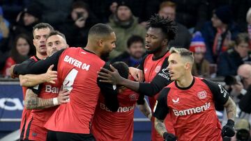 Bayer Leverkusen's players celebrate after scoring a goal during the German first division Bundesliga football match between Bayer 04 Leverkusen und 1 FC Heidenheim in Leverkusen, western Germany on November 23, 2024. (Photo by Sascha Schuermann / AFP) / DFL REGULATIONS PROHIBIT ANY USE OF PHOTOGRAPHS AS IMAGE SEQUENCES AND/OR QUASI-VIDEO
