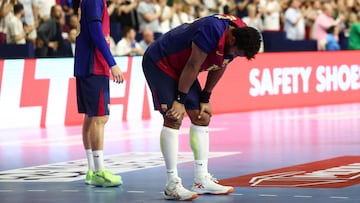 Handball - EHF Men's Handball Champions League - Semi Finals - Barcelona v SC Magdeburg - Lanxess Arena, Cologne, Germany - June 14, 2025 Barcelona's Timothey N'guessan looks dejected after the match REUTERS/Leon Kuegeler