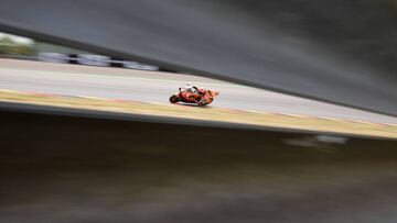 Repsol Honda Team's Spanish rider Marc Marquez rides during the second free practice session ahead of the Moto GP Grand Prix Germany at the Sachsenring Circuit on July 5, 2015 in Hohenstein-Ernstthal, eastern Germany. (Photo by Tobias SCHWARZ / AFP)