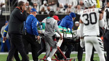 (FILES) In this file photo taken on September 29, 2022, medical staff tend to quarterback Tua Tagovailoa, #1 of the Miami Dolphins, as he is carted off on a stretcher after an injury during the 2nd quarter of the game against the Cincinnati Bengals at Paycor Stadium in Cincinnati, Ohio. - Miami Dolphins quarterback Tua Tagovailoa, whose medical health is the subject of an NFL investigation, will miss next Sunday's game against the New York Jets due to a concussion. (Photo by Dylan Buell / GETTY IMAGES NORTH AMERICA / AFP)