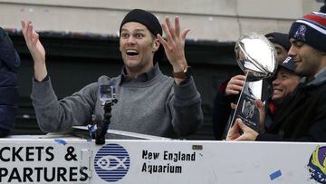 New England Patriots quarterback Tom Brady gestures beside Jimmy Garoppolo, holding the Super Bowl trophy, during a parade Tuesday, Feb. 7, 2017, in Boston to celebrate their 34-28 win over the Atlanta Falcons in Sunday&#039;s NFL Super Bowl 51 football game in Houston. (AP Photo/Charles Krupa)