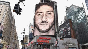 (FILES) In this file photo taken on September 08, 2018 a Nike Ad featuring American football quarterback  Colin Kaepernick is on diplay in New York City. - Nike withdrew a shoe displaying an early version of the American flag after former NFL quarterback Colin Kaepernick warned the design was associated with slavery, US media reported on July 1, 2019. (Photo by Angela Weiss / AFP)