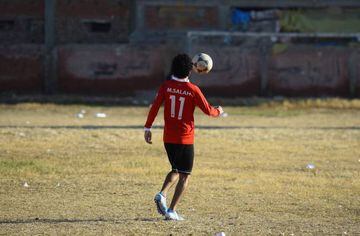 An Egyptian boy pictured playing football at the Mohamed Salah Youth Center in Nagrig, Egypt.