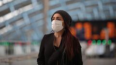 LONDON, ENGLAND - MAY 18: A commuter wears a protective face mask at Waterloo station on May 18, 2020 in London, England. The British government has started easing the lockdown it imposed two months ago to curb the spread of Covid-19, abandoning its &#039