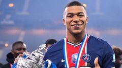 Paris Saint-Germain&#039;s French forward Kylian Mbappe celebrates with the trophy after winning the French Cup final football match between Paris Saint-Germain and Monaco at the Stade de France stadium, in Saint-Denis, on the outskirts of Paris, on May 1